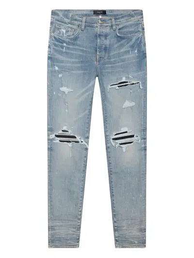 Amiri Ripped Knee Denim Jeans In Blue
