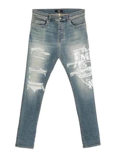Amiri Ripped Print Jeans In Blue