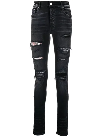 Amiri Ripped Slim-fit Jeans In Schwarz