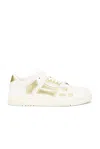 Amiri Metallic Skel Top Low Sneaker White Gold In White & Gold
