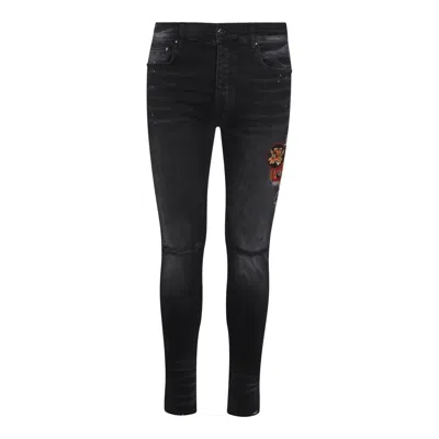 Amiri Skinny Jeans With Patches In Black