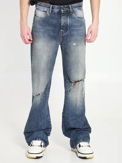 Amiri Slashed Boot Cut Jeans In Blue