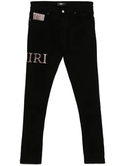 Amiri Snake Logo Jeans In Black