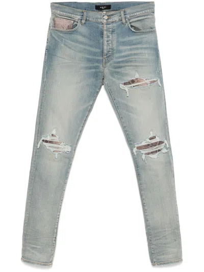 Amiri Mx1 Skinny-fit Panelled Distressed Jeans In Blue