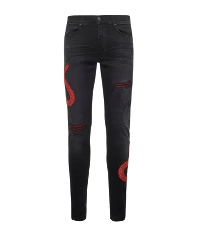 Amiri Snake Printed Distressed Jeans In Black