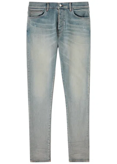 Amiri Stack Distressed Slim-leg Jeans In Indigo