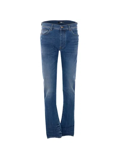 Amiri Stack Skinny Jeans In Blue