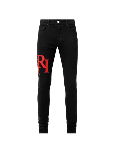 Amiri Staggered Logo Skinny Jeans In Black