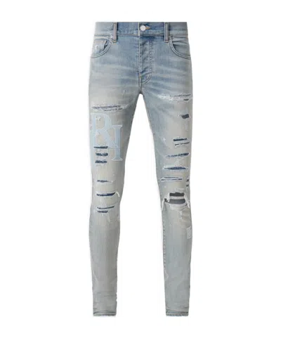 Amiri Staggered-logo Skinny Jeans In Gray