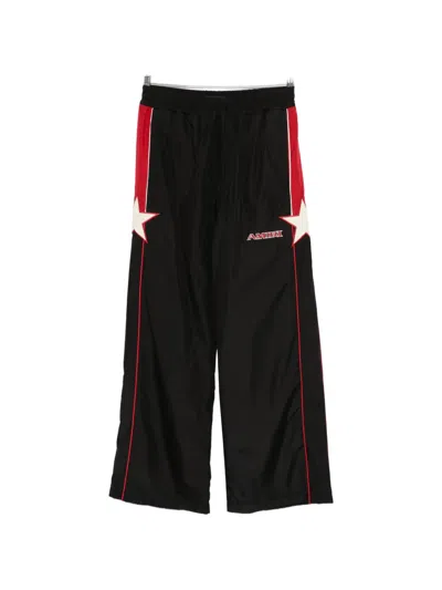 Amiri Star Panelled Track Pants In Black
