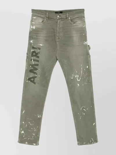 AMIRI STENCIL SLIM JEANS WITH BELT LOOPS AND CARGO POCKETS