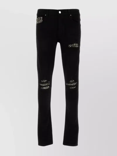Amiri Stretch Denim Jeans With Leopard Print Accents In Black