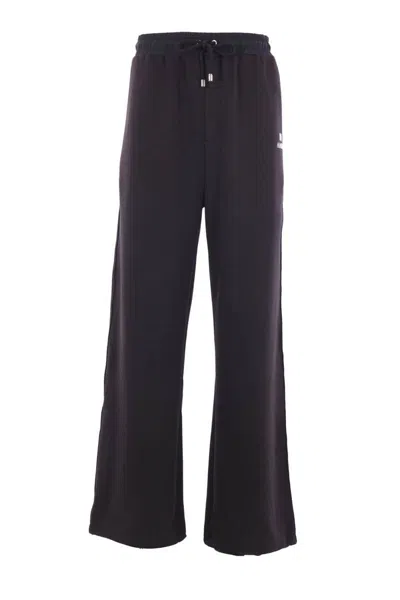 Amiri Trousers In Black
