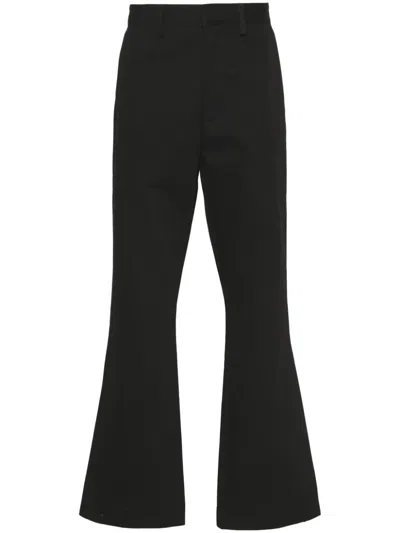 Amiri Trousers In Black