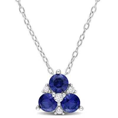 Amour 1 1/2 Ct Tgw Created Blue Sapphire And Created White Sapphire 3-stone Pendant With Chain In St