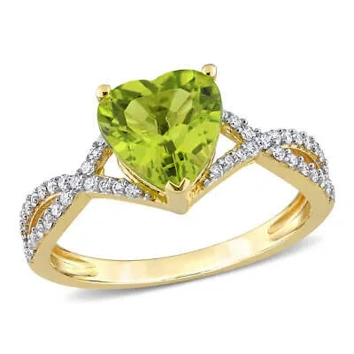 Pre-owned Amour 1 5/8 Ct Tgw Heart Peridot And 1/5 Ct Tdw Diamond Infinity Ring In 14k In Yellow