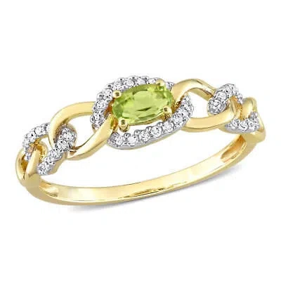 Pre-owned Amour 1/4 Ct Tgw Peridot And 1/8 Ct Tdw Diamond Mini Oval Link Ring In 10k In Yellow