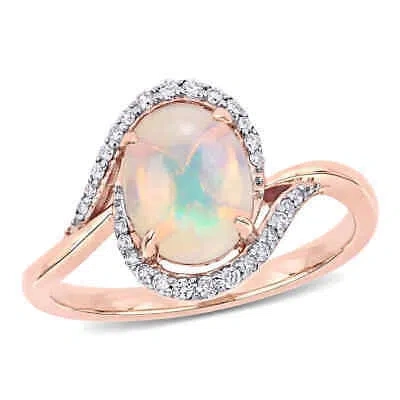 Pre-owned Amour Ethiopian Blue Opal And 1/7 Ct Tw Diamond Oval Halo Twist Ring In 10k Rose In Pink
