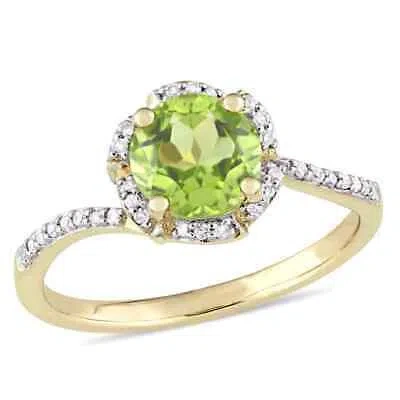 Pre-owned Amour Peridot And 1/10 Ct Tw Diamond Halo Ring In 14k Yellow Gold In Green
