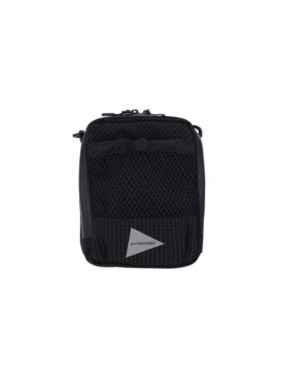 And Wander Compact Crossbody Pouch In Black