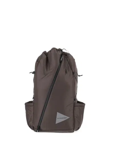 And Wander Diagonal-zip Drawstring Backpack In Brown