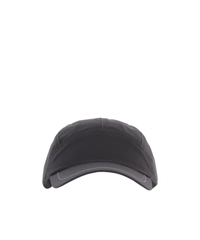 And Wander Drawstring Hat In Black