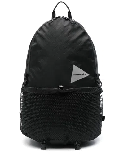And Wander Logo-print Backpack In Black