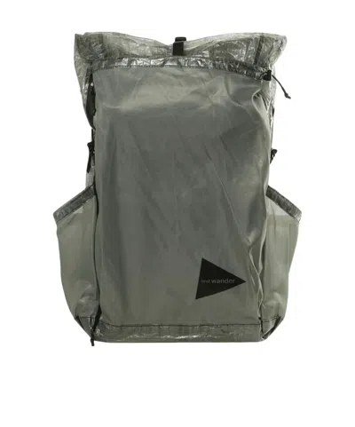 And Wander Logo Printed Backpack In Black