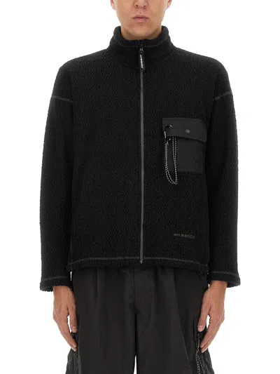 AND WANDER PILE SWEATSHIRT.