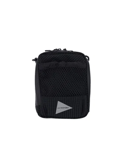 And Wander 'reflective' Crossbody Pouch Bag In Black  