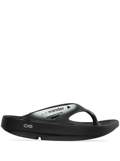 And Wander X137 Oofos Recovery Sandals In Black