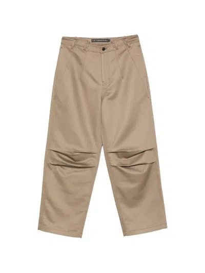 Andersson Bell Logo-patch Panelled Trousers In Brown