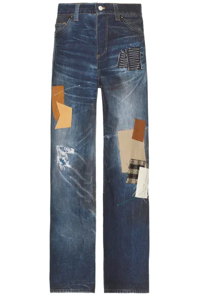 ANDERSSON BELL UNISEX PATCHWORK PRINTED DENIM TROMPE L`OEIL JEANS
