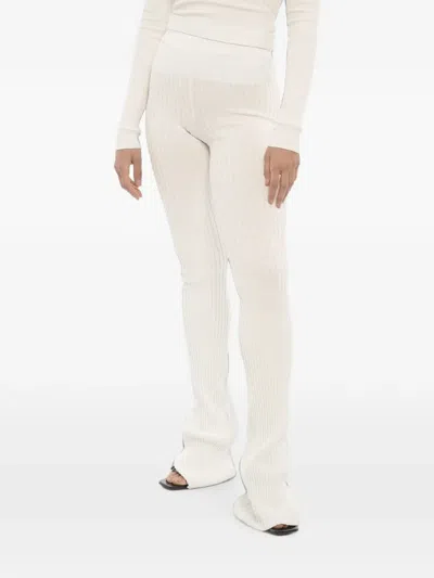 Andreädamo Ribbed-knit Flared Trousers In Neutral