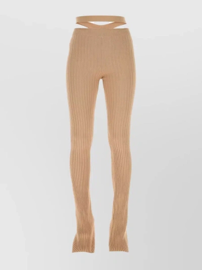 ANDREÄDAMO VISCOSE BLEND PANT WITH FLARED HEM AND WAIST CUT-OUT