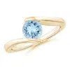 Angara Bar-set Solitaire Round Aquamarine Bypass Ring In Yellow Gold/light Swiss Blue