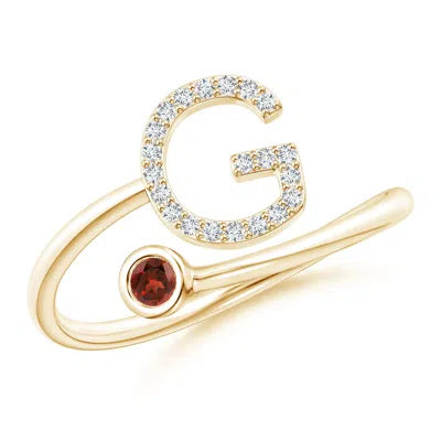Angara Capital "g" Diamond Initial Ring With Bezel-set Garnet In Gold