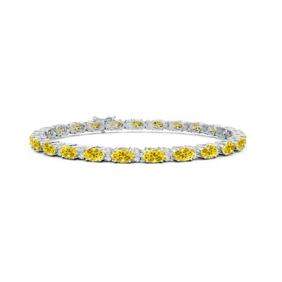 Angara Classic Oval Fancy Intense Yellow And White Diamond Tennis Bracelet