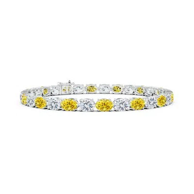 Angara Classic Oval Fancy Intense Yellow And White Diamond Tennis Link Bracelet