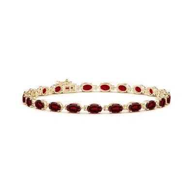 Angara Classic Oval Garnet Tennis Bracelet In Gold