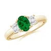 Angara Classic Oval Lab-grown Emerald And Trapezoid Diamond Three Stone Engagement Ring In Yellow Gold/rich Green