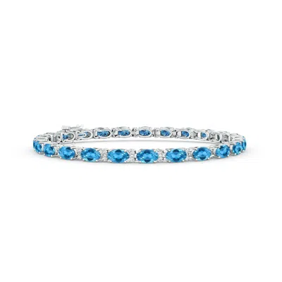 Angara Classic Oval Swiss Blue Topaz And Diamond Tennis Bracelet