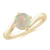 Angara Classic Round Opal Solitaire Bypass Ring In Yellow Gold/milky With High Play Of Colour