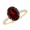 Angara Claw-set Oval Garnet Ring With Diamonds In Yellow Gold/medium Red