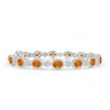 Angara Claw-set Oval Halo Orange Sapphire And Diamond Bracelet In White Gold/deep Orange
