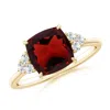 Angara Cushion Garnet Engagement Ring With Trio Diamonds In Yellow Gold/medium Red