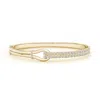 Angara Diamond Encrusted Interlocking Love Knot Bracelet In Yellow Gold/h
