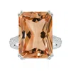 Angara Double Claw-set Gia Certified Solitaire Emerald-cut Morganite Ring With Leaf Motifs In White Gold/peachy Pink