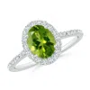 Angara Double Claw-set Oval Peridot Halo Ring With Diamonds In White Gold/green