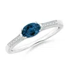 Angara East-west Oval London Blue Topaz Solitaire Ring With Diamonds In White Gold/greenish Blue